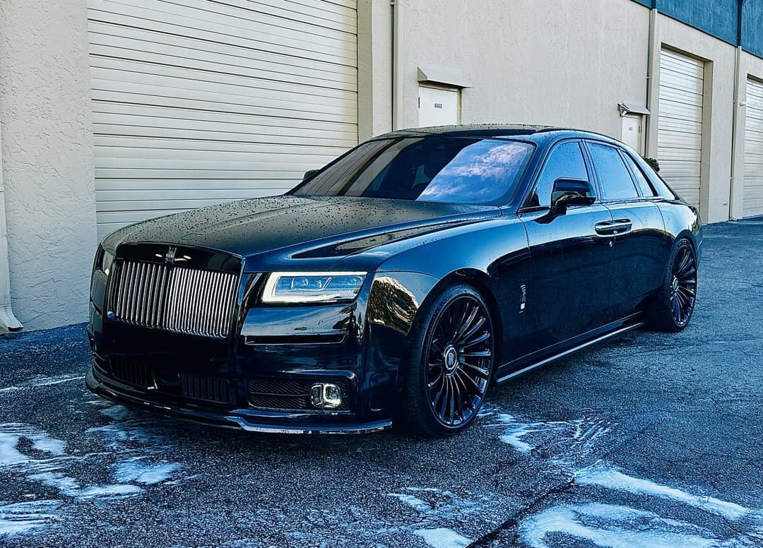 Blacked-out Rolls-Royce Ghost with tinted glass