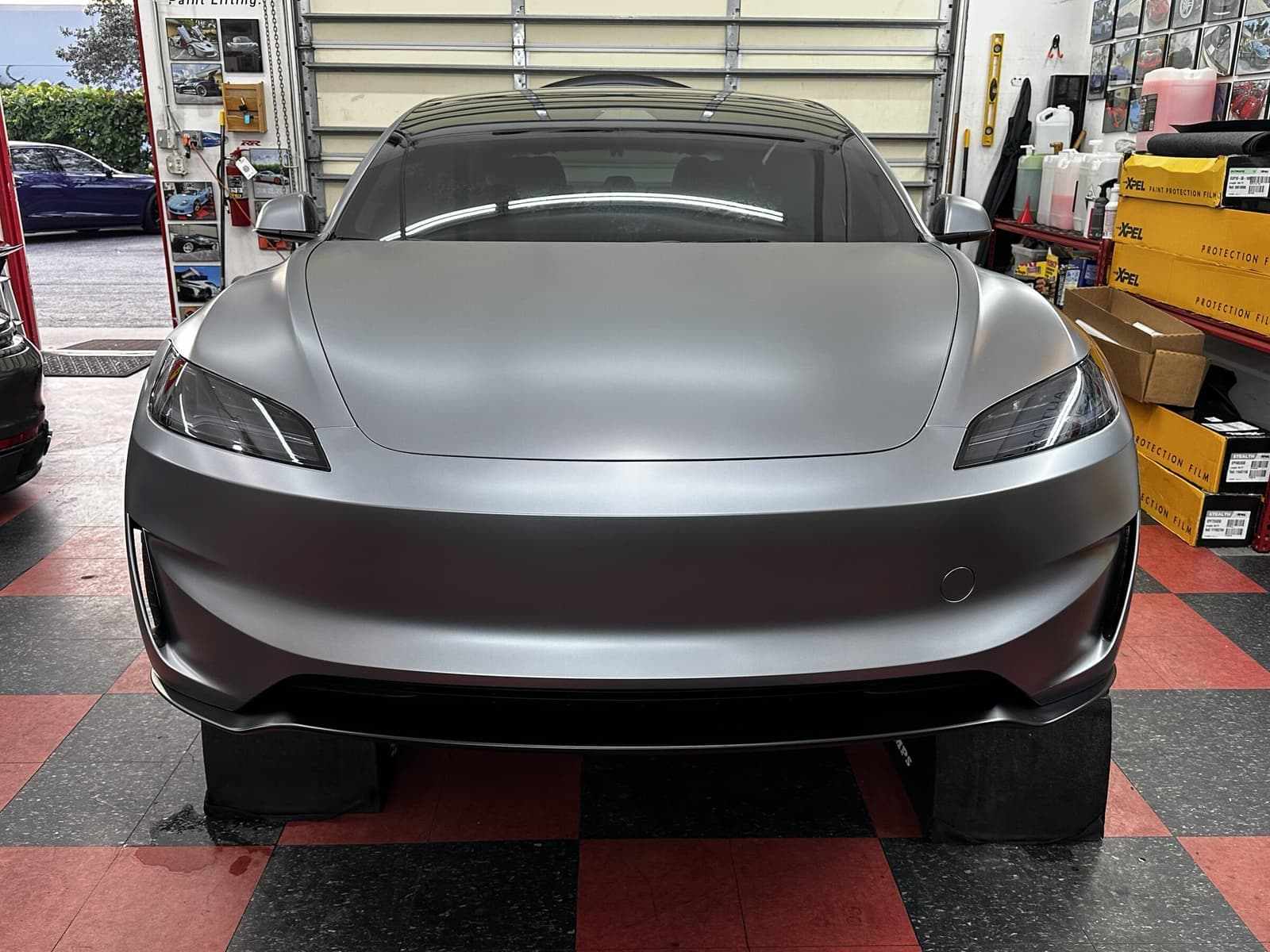 Matte Tesla in the Auto SuperShield installation bay in Boca Raton