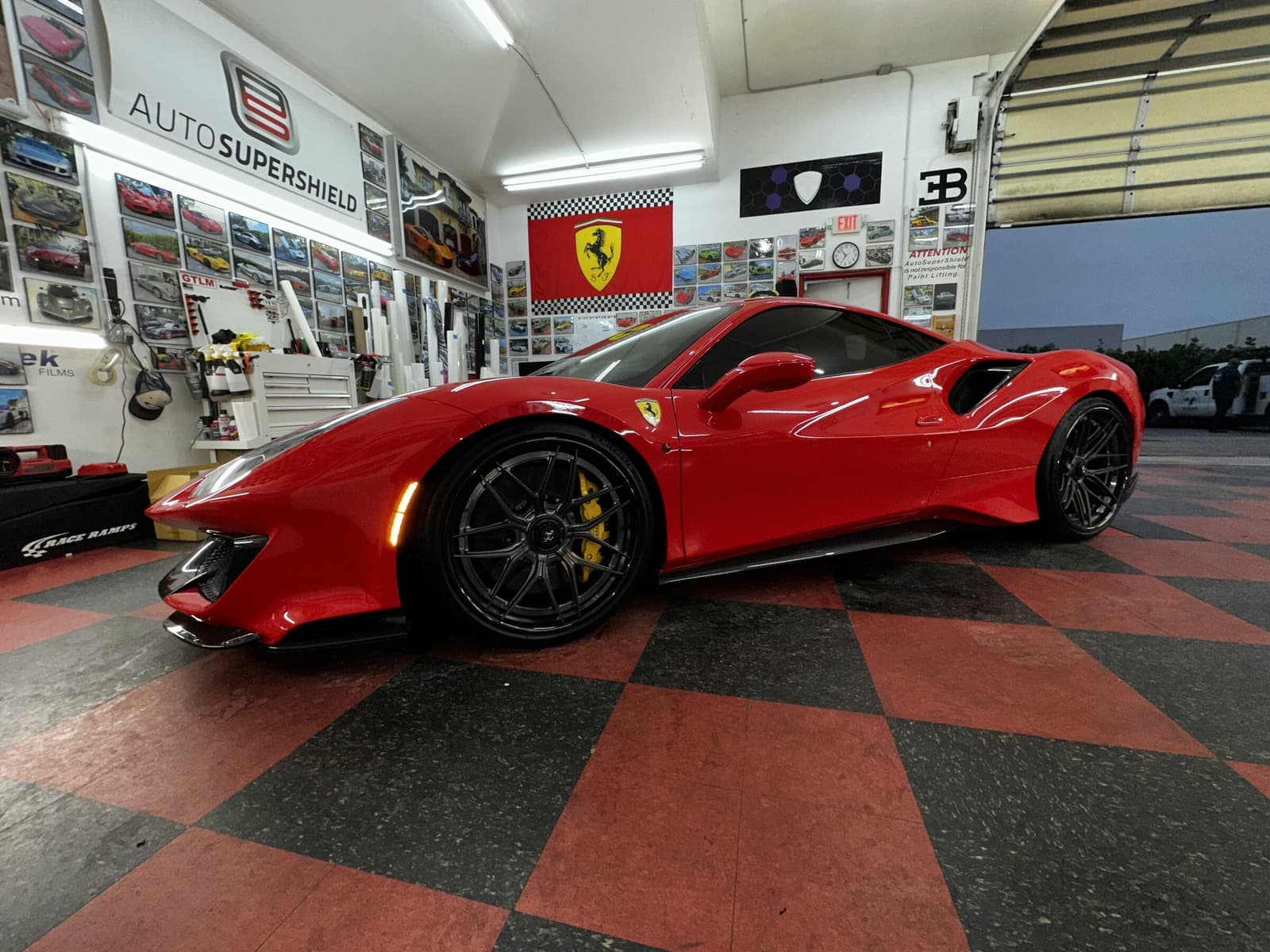 Red Ferrari 488 Pista with XPEL Ultimate Fusion PPF inside Auto SuperShield's Boca Raton facility