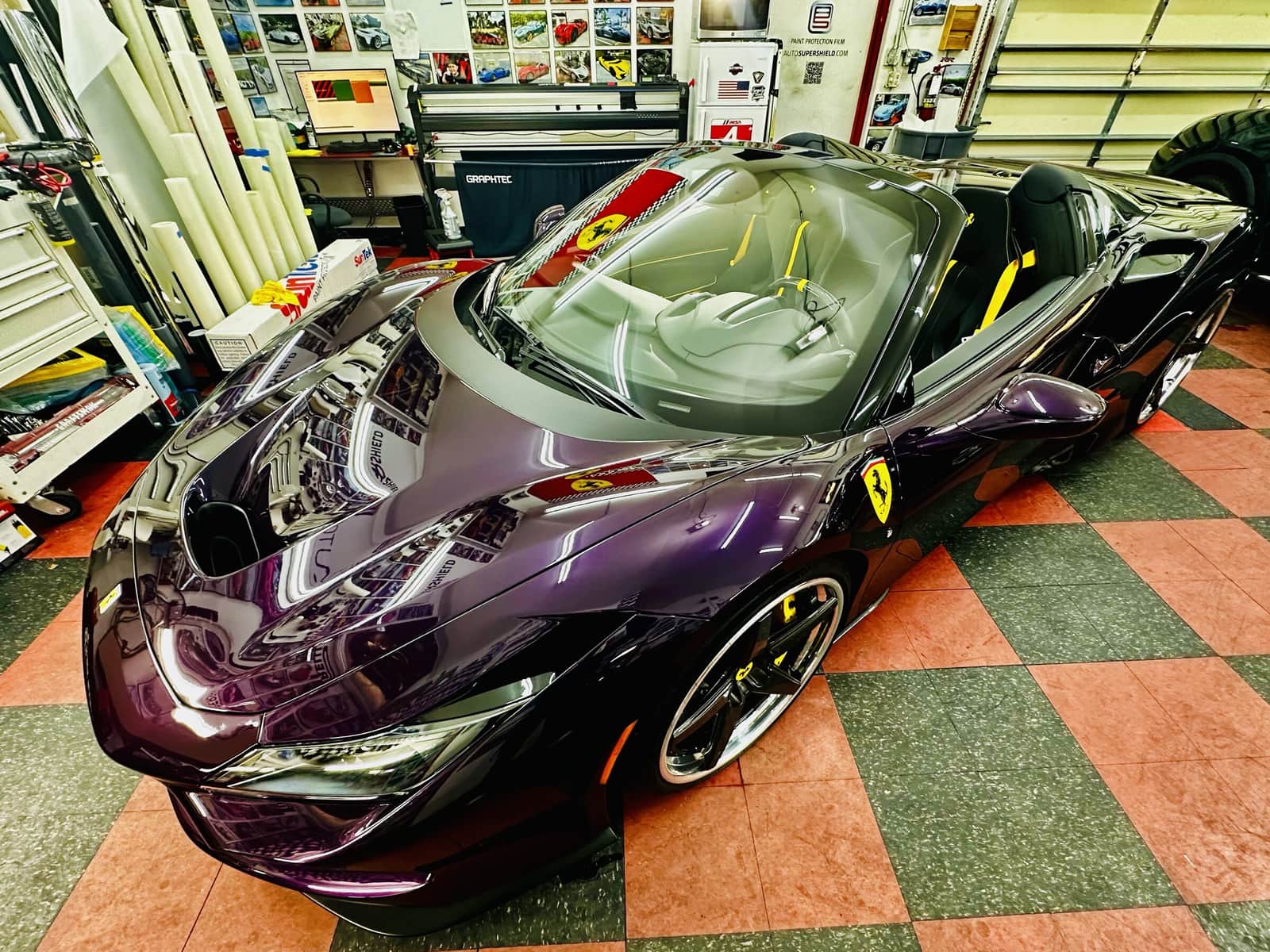 Purple color-wrapped Ferrari on the Auto SuperShield checker floor in Boca Raton
